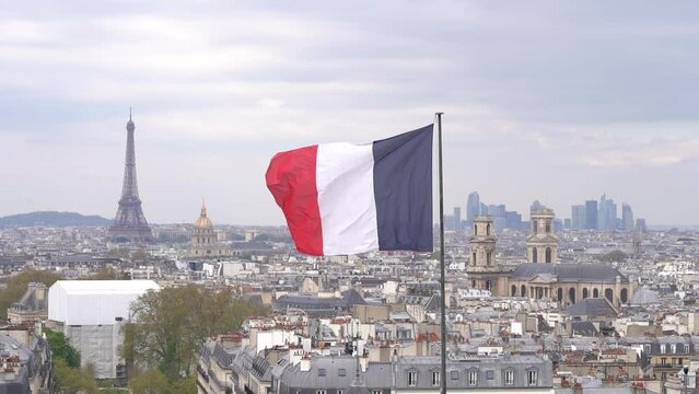 French Flag Floating In the Wind Over Paris Skyline, Main Monument and La Défence in the Background