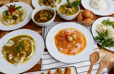 Rice noodles with curry sauce with a boiled egg. Eat with a variety of vegetables for deliciousness. It has a spicy flavor from spices and herbs. (Kanom Jeen Nam Ya)
