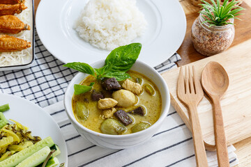 Thai food chicken green curry on old wooden background, Top view. Thai Street Food