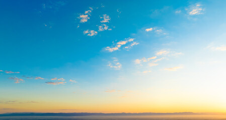 Enjoy a panoramic view of the skyline. The sun rises in the morning sky with colorful clouds. and...