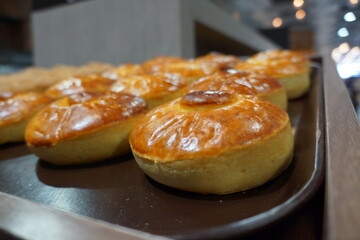 Macro of Spanish bisquet tradicional pastry in tray, in store, well lit and shiny