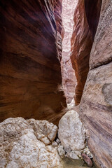 High  cliffs with beautiful natural patterns along walking trail in Wadi Numeira gorge in Jordan