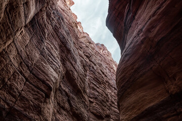 Natural  beauty of high cliffs with beautiful natural patterns along walking trail in Wadi Numeira gorge in Jordan