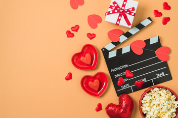 Happy Valentine's day and romantic movie concept with  movie clapper board, heart shapes and...