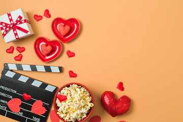 Happy Valentine's day and romantic movie concept with  movie clapper board, heart shapes and...