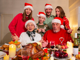 A happy family holds a Christmas party at home on the holiday.