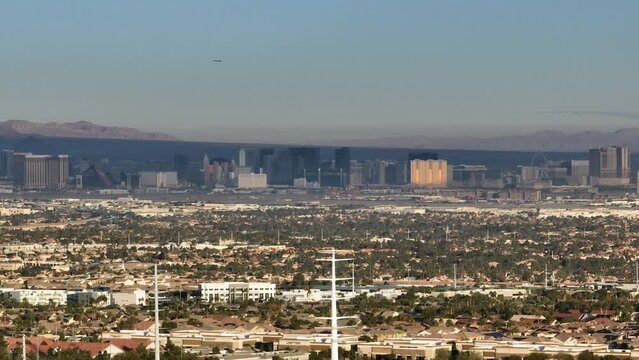Aerial Reveal of Las Vegas Strip During the Day from Rocky Desert Landscape