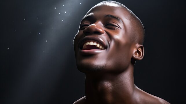 Confident black man embracing the beauty of his flawless melanin skin in studio portrait