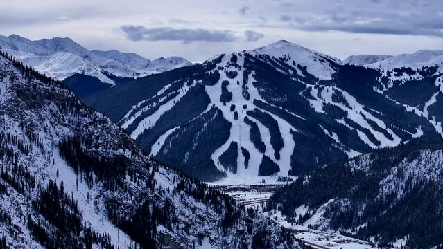 Ski runs trails Distant  i70 Copper Mountain Leadville Colorado Winter December Christmas aerial drone cinematic landscape Silverthorne Vail Aspen Ten Mile Range cloudy Rocky Mountains right circle