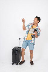 A cheerful Asian man in summer clothes excited for his summer vacation trip, isolated background.