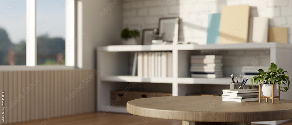 Aufkleber close-up image of an empty space on a wooden round table in a modern room with a bookcase.