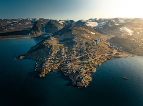 Sunlit Isolation: Aerial View of Ittoqqortoormiit, Greenland's Remote Settlement