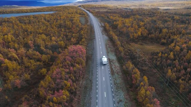 50fps drone footgage Car Camping Caravan driving road lake Swedish Lapland Sunny fall colors Abisko National Park Sweden