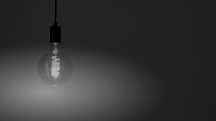 Retro Edison lamp. Black and white photography. Space for text. Copyspace.