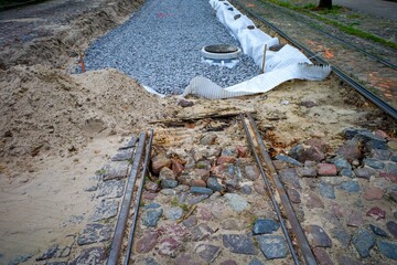 Installation of tram lines. Narrow gauge railway.