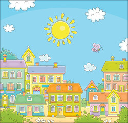 Funny colorful houses of a pretty little town on a sunny summer day, vector cartoon illustration on a white background