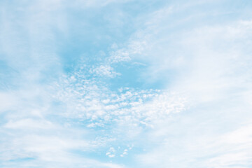 A beautiful sky tinted by the sun leaving vibrant shades of gold, pink, blue and multicolored. Clouds in the twilight evening and morning sky. Cloudy sky background in the evening and during the day.