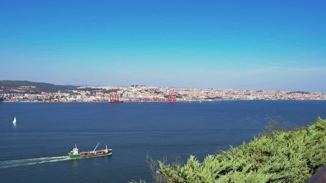 Historical capital of Portugal, Lisbon cityscape over the Tagus River from Almada in the daytime.