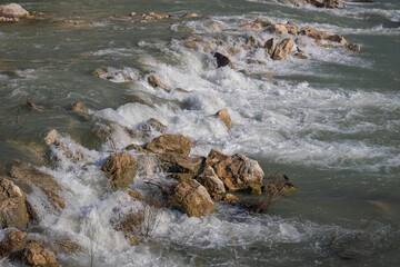 water flowing enthusiastically between rocks. waterfall.