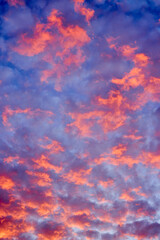 Beautiful landscape with a sky with red-orange hues created due to several meteorological factors.