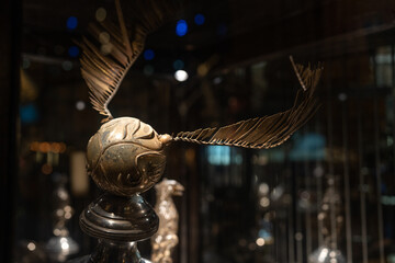 Obraz premium JAPAN - NOV 13, 2023: Quidditch or golden snitch equipment for sport play game with flying broomstick at Warner Bros. Studio Tour Tokyo, The Making of Harry Potter, Wizarding World