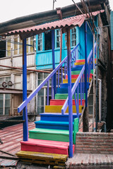 Fototapeta na wymiar Colorful staircase of an old decayed house in Kldisubani, Tbilisi old town, Georgia