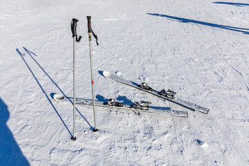 Skis and ski poles on the ski slope