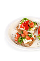 Fototapeta na wymiar Sandwiches with soft cheese and herbs and tomatoes