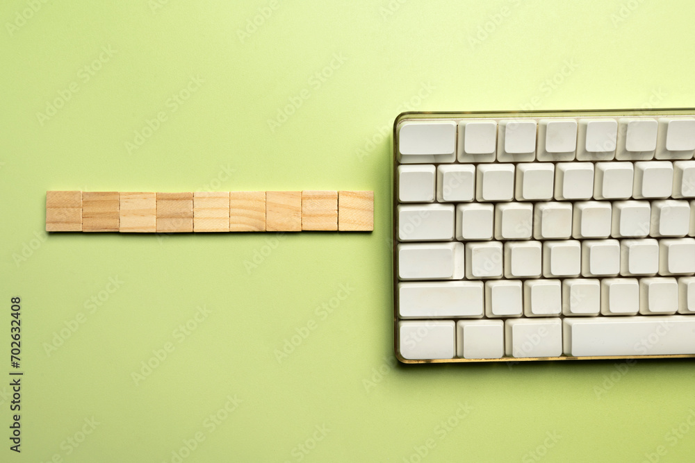 Poster closeup view of a computer keyboard with a wooden cube