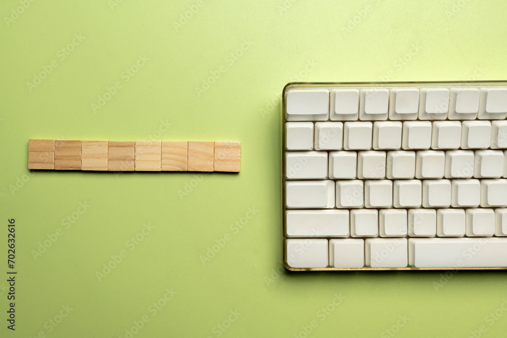 Poster closeup view of a computer keyboard with a wooden cube