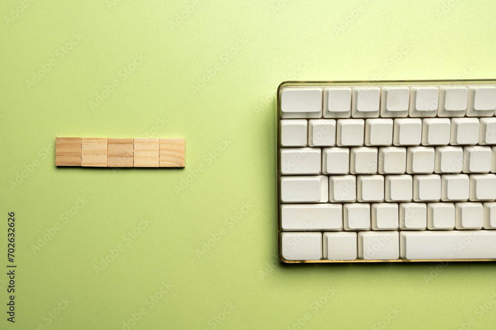 Poster closeup view of a computer keyboard with a wooden cube