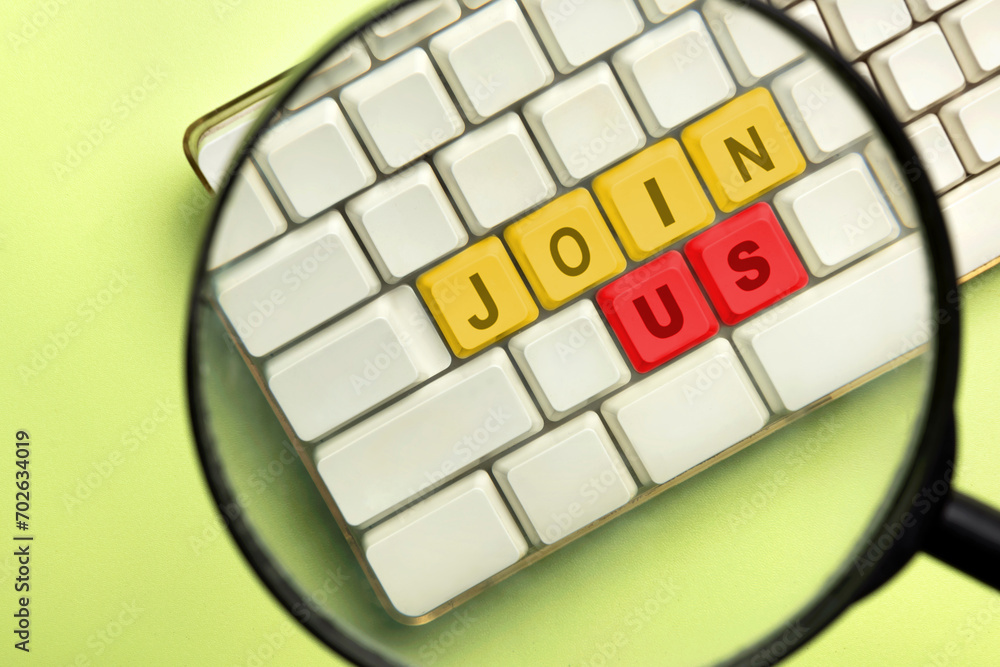Poster the magnifying glass focuses on the computer keyboard button with join us words