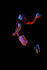Athletic young woman, sportsman showing handball techniques, emphasizing skill and dedication...