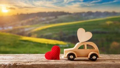 Foto auf Glas Valentine's day holiday celebration with a wooden toy car and heart shape, countryside © Giuseppe Cammino