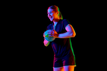 Portrait of young woman, handball player holding ball to make perfect precise serve early in game...