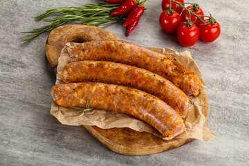 Raw sausages with spices and herbs