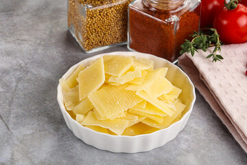 Sliced parmesan cheese in the bowl