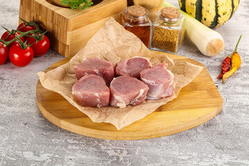 Uncooked raw pork tenderloin medallions