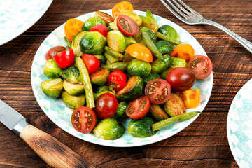 Vegetable salad with baked brussels sprouts.