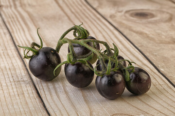 Ripe tasty black cherry tomato