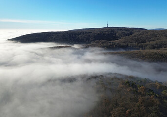 View over clouds of the radio tower Kamzik in Bratislava, Slovakia