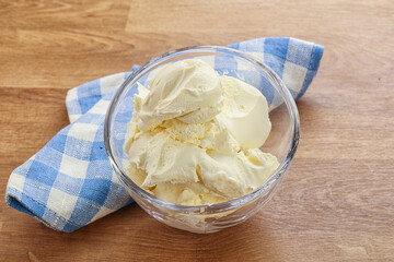 Italian soft mascarpone cheese in the bowl