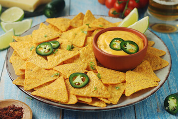Corn tortilla chips with cheese sauce