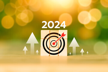 2024 text on wooden cubes. Happy New Year. Business achievement goal and objective target,...