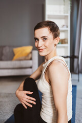 Young Woman Practicing Yoga in Living Room