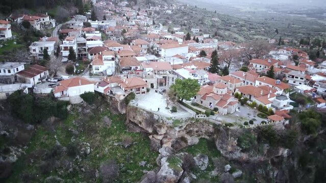 Ascending drone footage of Tithorea village at sunset in Amfikleia-Elateia, Phthiotis, Greece