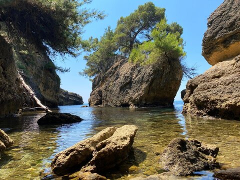 Rocks in the sea by Mediterranean coast