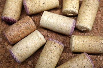 Still life with ten used wine corks on cork background top view close up