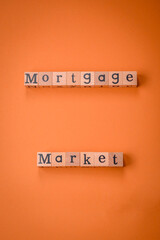 A small wooden house and keys as an idea for investing in your own home