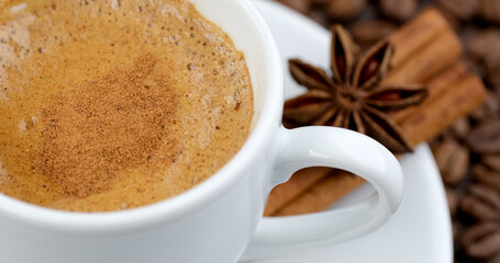 Cinnamon coffee. Mixing coffee with cinnamon powder